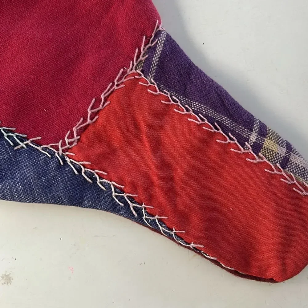 Two vintage handmade embroidered patchwork Christmas stockings